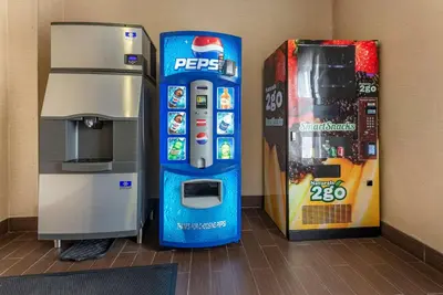 a pepsi machine next to a drink vending machine at Comfort Suites Newark - Harrison in Newark
