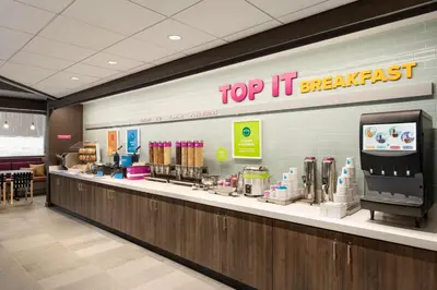 a top it breakfast counter in a store at Tru By Hilton Albany Airport, Ny in Latham
