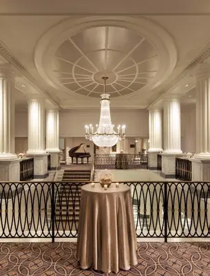 a large lobby with a table in the middle of it at InterContinental New York Barclay Hotel by IHG in New York