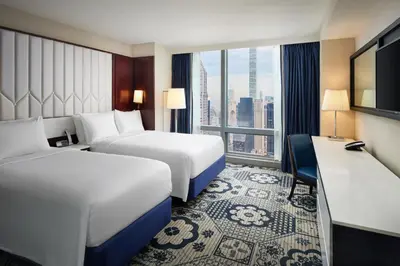 a hotel room with two beds and a window at Residence Inn by Marriott New York Manhattan/Central Park in New York