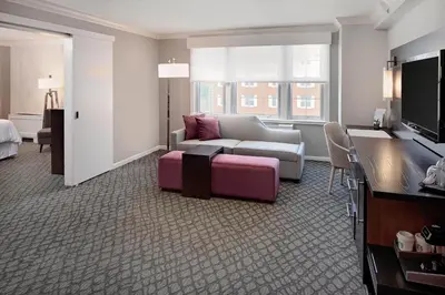 a living room with a couch and a tv at The Westin Governor Morris, Morristown in Morristown