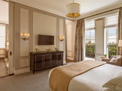 a bedroom with a bed and a flat screen tv at The Plaza in New York
