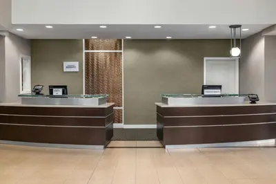 a lobby of a hospital with two reception desks at Residence Inn by Marriott Albany Washington Avenue in Albany