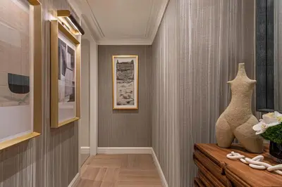 a hallway with a vase on a dresser at JW Marriott Essex House New York in New York