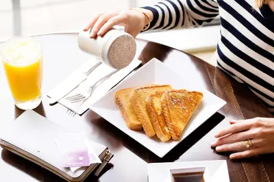 a table with a plate of toast and a drink at Hyatt Place Milford/New Haven in Milford