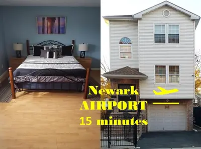 a bedroom with a bed and a house at 500 Estates LLC in Irvington