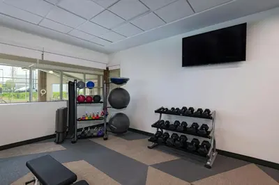a room with a gym with a bunch of weights at Element Spring Valley in Spring Valley