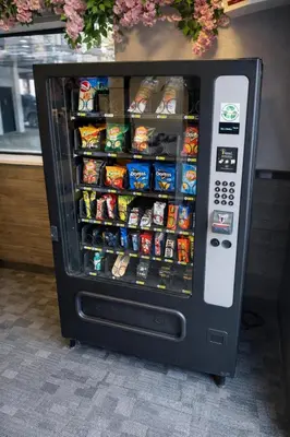 a vending machine filled with food and drinks at Cabana Hotel Yankee Stadium in Bronx