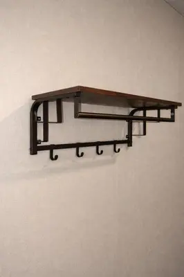 a wooden shelf hanging on a wall at Cabana Hotel Yankee Stadium in Bronx
