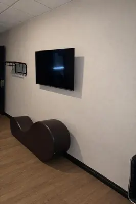 a flat screen tv hanging on a wall at Cabana Hotel Yankee Stadium in Bronx