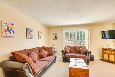 a living room with a couch and a chair at Homey Windham Condo Hike and Ski the Catskill Mtns! in Windham