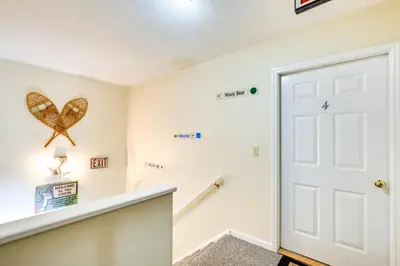 a room with a white door and a butterfly on the wall at Homey Windham Condo Hike and Ski the Catskill Mtns! in Windham