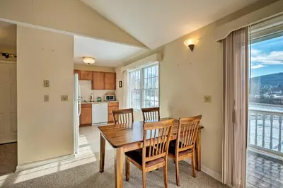 a kitchen and dining room with a table and chairs at Condo with Loft 2 Mi to Windham Mountain Ski! in Windham