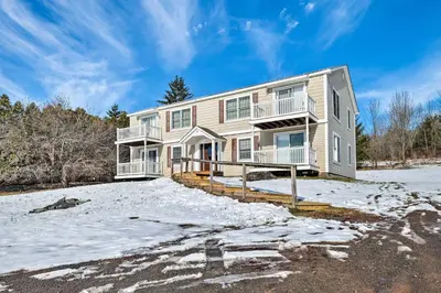 a house on a hill in the snow at Condo with Loft 2 Mi to Windham Mountain Ski! in Windham