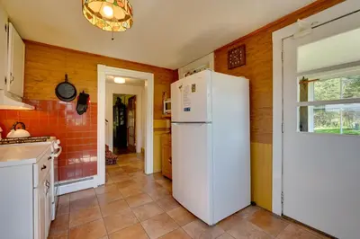 a kitchen with a white refrigerator in a room at Johns Farmhouse in Mount Snow on 120 Acres! in Whitingham