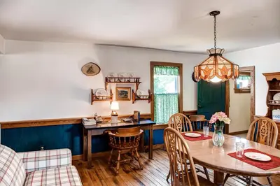 a dining room with a table and chairs at 5 Mi to Cooperstown All Star Village Otego Home in Otego