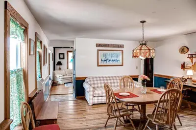 a living room with a table and chairs and a couch at 5 Mi to Cooperstown All Star Village Otego Home in Otego