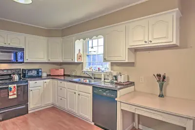 a kitchen with white cabinets and a counter top at Serene Retreat - 7 Mi to All Star Village in Otego