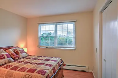 a bedroom with a bed and a window at Serene Retreat - 7 Mi to All Star Village in Otego