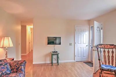 a living room with a couch and a tv at Serene Retreat - 7 Mi to All Star Village in Otego