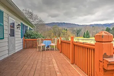 a patio with a table and chairs on a house at Serene Retreat - 7 Mi to All Star Village in Otego