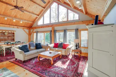 a living room with two couches and a table at 1 Mi to Mt Snow Luna Stella Home with Fireplace in West Dover