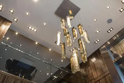 a chandelier hanging from the ceiling in a building at Opera House Hotel in Bronx