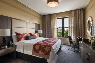 a hotel room with a bed and a window at Opera House Hotel in Bronx