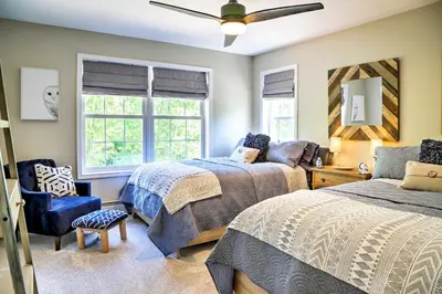 a bedroom with two beds and a ceiling fan at Colonial-Style Warwick Retreat - 1 Hour to NYC! in Warwick