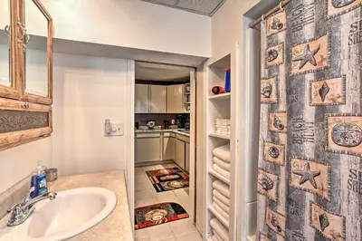 a bathroom with a sink and a shower curtain at Cozy Agawam Studio with Yard 2 Miles to Six Flags! in Agawam
