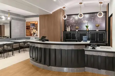 a bar in a restaurant with tables and chairs at Fairfield Inn by Marriott New York Manhattan/Financial District in New York
