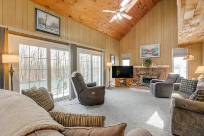 a living room with a fireplace and a tv at Near Hiking and Skiing Home in Wilmington! in Wilmington