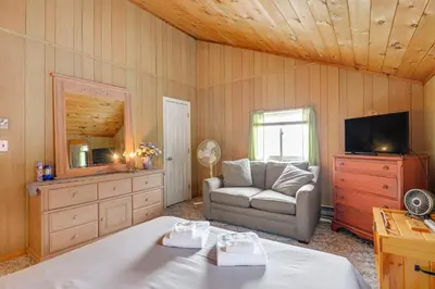 a living room with a couch and a television at Near Hiking and Skiing Home in Wilmington! in Wilmington