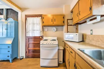 a kitchen with a stove and a microwave at Beachfront Connecticut Retreat with Views! in Milford