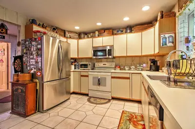a kitchen with a stainless steel refrigerator and appliances at West Dover Vacation Rental with Hot Tub Near Mt Snow in West Dover