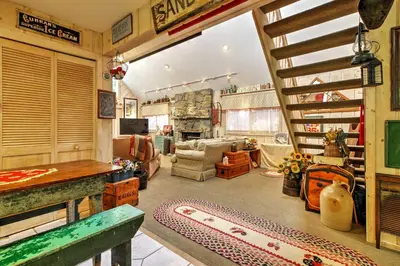 a large room with a living room with a stairway at West Dover Vacation Rental with Hot Tub Near Mt Snow in West Dover