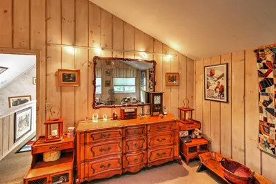 a bathroom with a large wooden dresser and a mirror at West Dover Vacation Rental with Hot Tub Near Mt Snow in West Dover