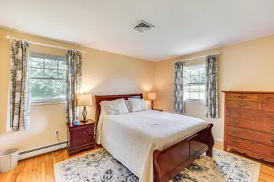 a bedroom with a bed and two windows at Hudson Valley Horse Farm Retreat in Salt Point in Salt Point