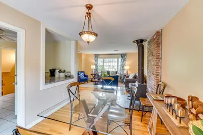 a dining room and living room with a glass table and chairs at Hudson Valley Horse Farm Retreat in Salt Point in Salt Point