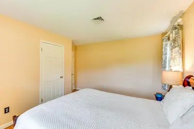 a bedroom with a white bed and a window at Hudson Valley Horse Farm Retreat in Salt Point in Salt Point