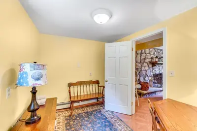 a living room with a table and a chair at Hudson Valley Horse Farm Retreat in Salt Point in Salt Point