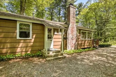 a small house with a brick chimney and a door at Pet-Friendly Cabin with Fire Pit, BBQ and Great Deck! in Williamsburg