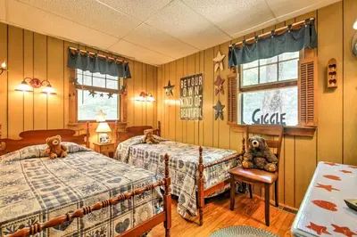 a bedroom with two beds with teddy bears on them at Pet-Friendly Cabin with Fire Pit, BBQ and Great Deck! in Williamsburg