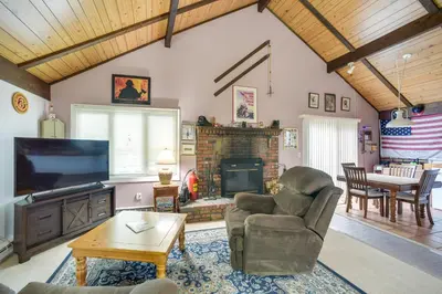 a living room with a couch chair and a fireplace at Hunter Hideaway with Yard and Deck 3 Mi to Ski Slopes in Hunter
