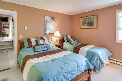 a bedroom with two beds and a window at Hunter Hideaway with Yard and Deck 3 Mi to Ski Slopes in Hunter