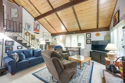a living room with a blue couch and chairs at Hunter Hideaway with Yard and Deck 3 Mi to Ski Slopes in Hunter