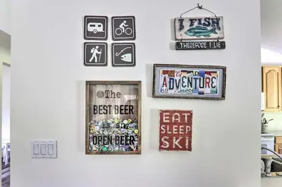 a wall with signs and pictures on it at Private Dog-Friendly Home 3 Mi to Elk Mountain in Union Dale