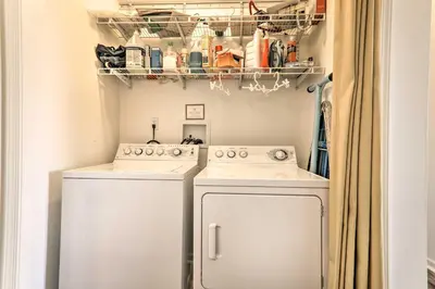 a laundry room with two washing machines and a shelf at Private Dog-Friendly Home 3 Mi to Elk Mountain in Union Dale