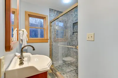 a bathroom with a sink and a shower at Slope Views Luxe Windham Retreat with Hot Tub! in Windham