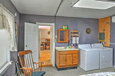 a laundry room with a washer and dryer at Saratoga Springs Apt - Walk to Town and Race Track! in Saratoga Springs